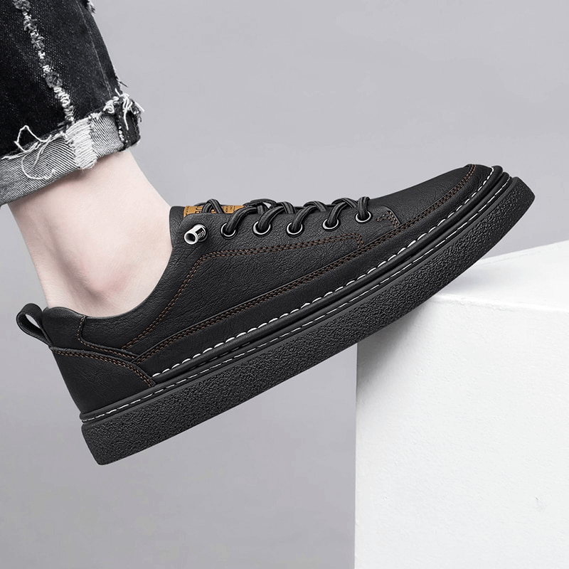 Stylish black leather men's sneaker, SF1182 model, with breathable design and comfortable rubber sole, perfect for athletic and casual wear.